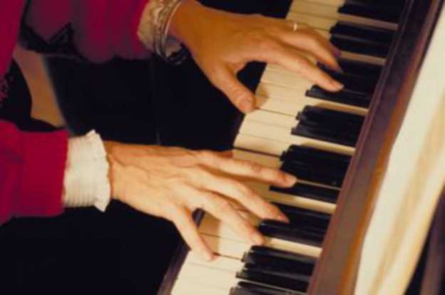 Adult playing the piano